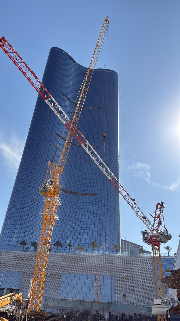 Maintenance team servicing the crane rotation and gear unit in Abu Dhabi.