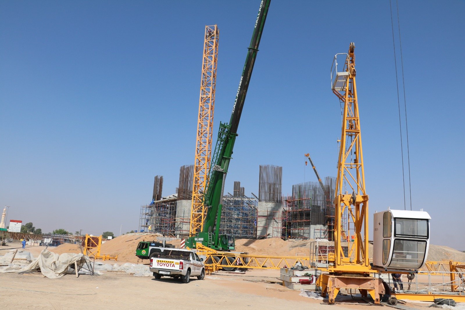 Tower crane components staged on site for controlled dismantling and removal.